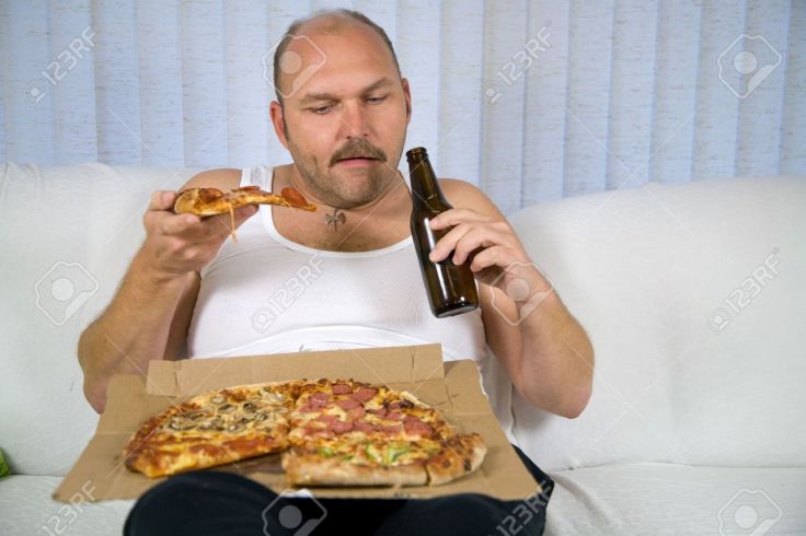 1849050-unhealthy-fat-man-sitting-on-couch-drinking-beer-and-eating-pizza